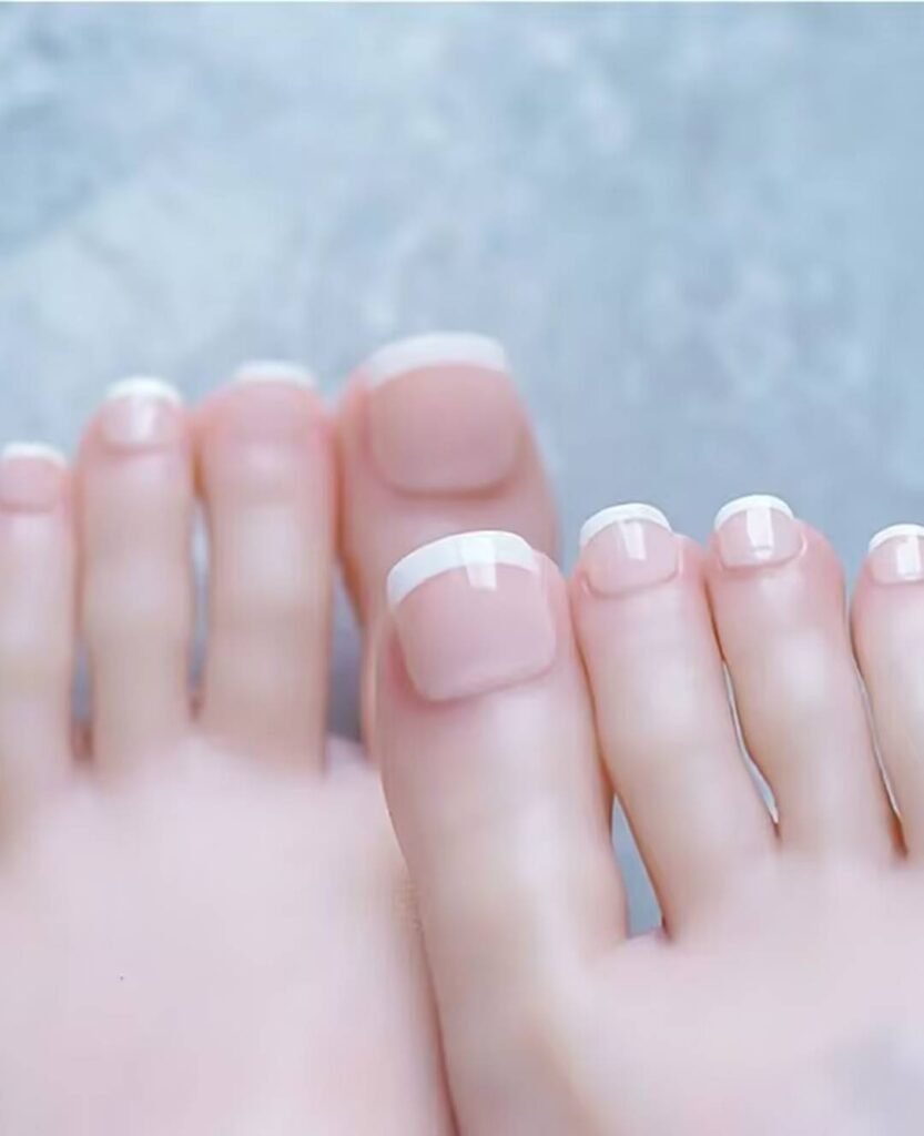 "2025 short toenail trends: minimalist geometric designs in earth tones with chrome accents, Korean-inspired negative space, low-maintenance styles."