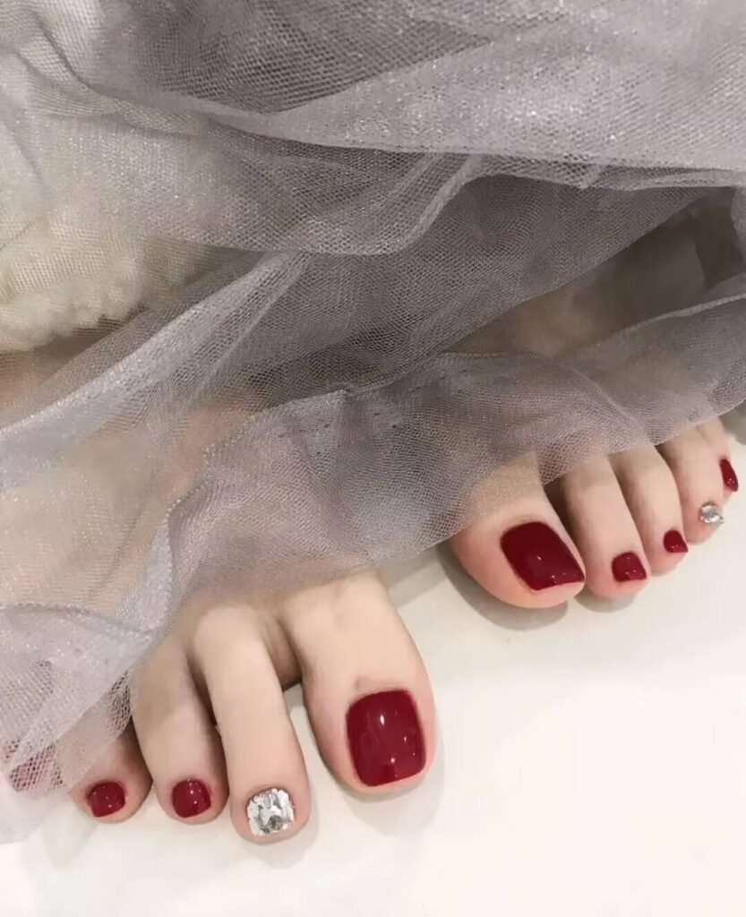 "2025 short toenail trends: minimalist geometric designs in earth tones with chrome accents, Korean-inspired negative space, low-maintenance styles."