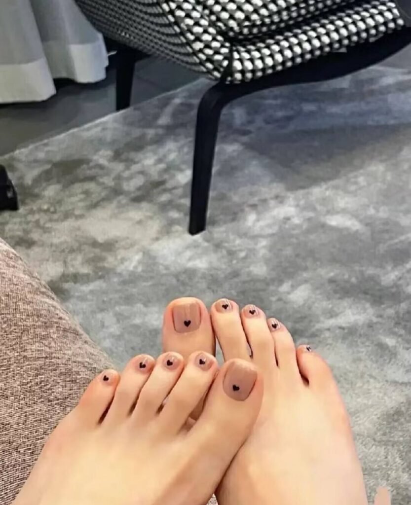 "2025 short toenail trends: minimalist geometric designs in earth tones with chrome accents, Korean-inspired negative space, low-maintenance styles."