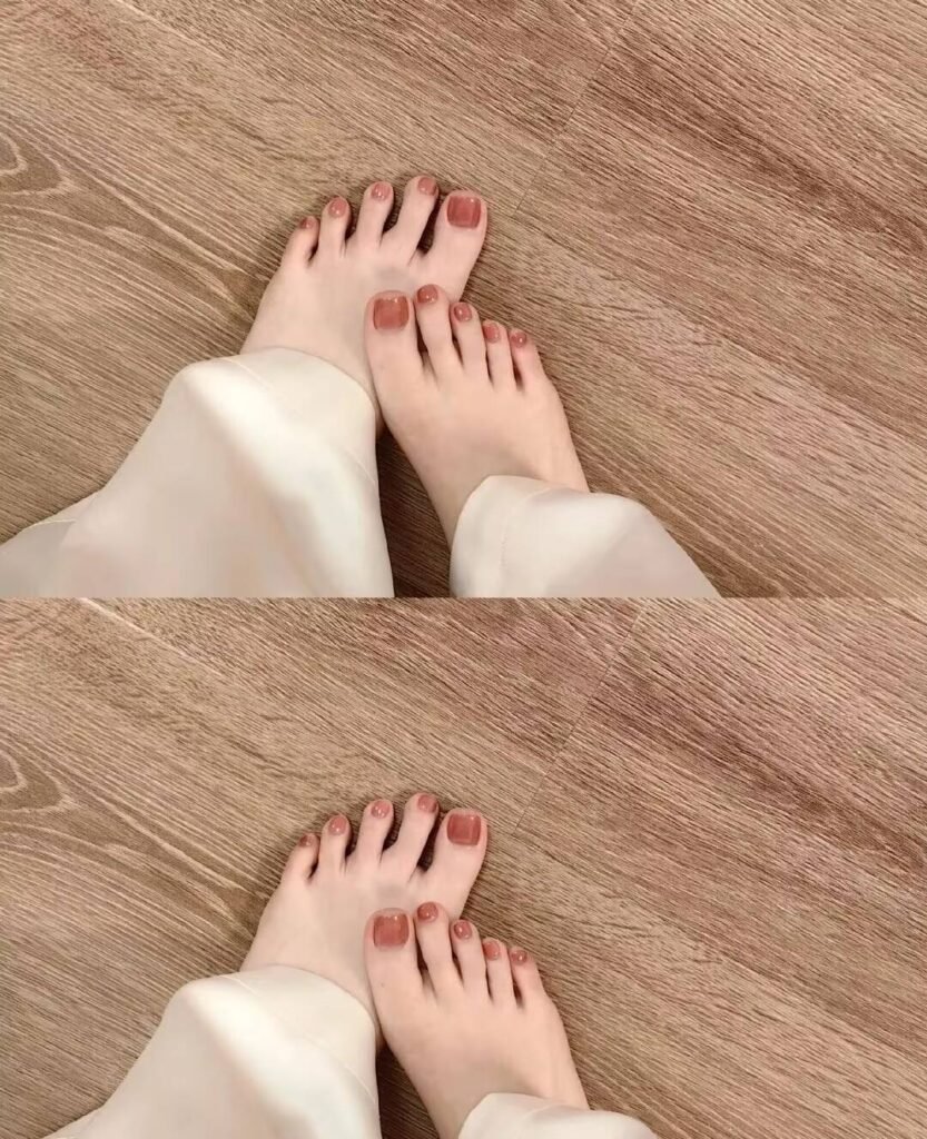 "2025 short toenail trends: minimalist geometric designs in earth tones with chrome accents, Korean-inspired negative space, low-maintenance styles."