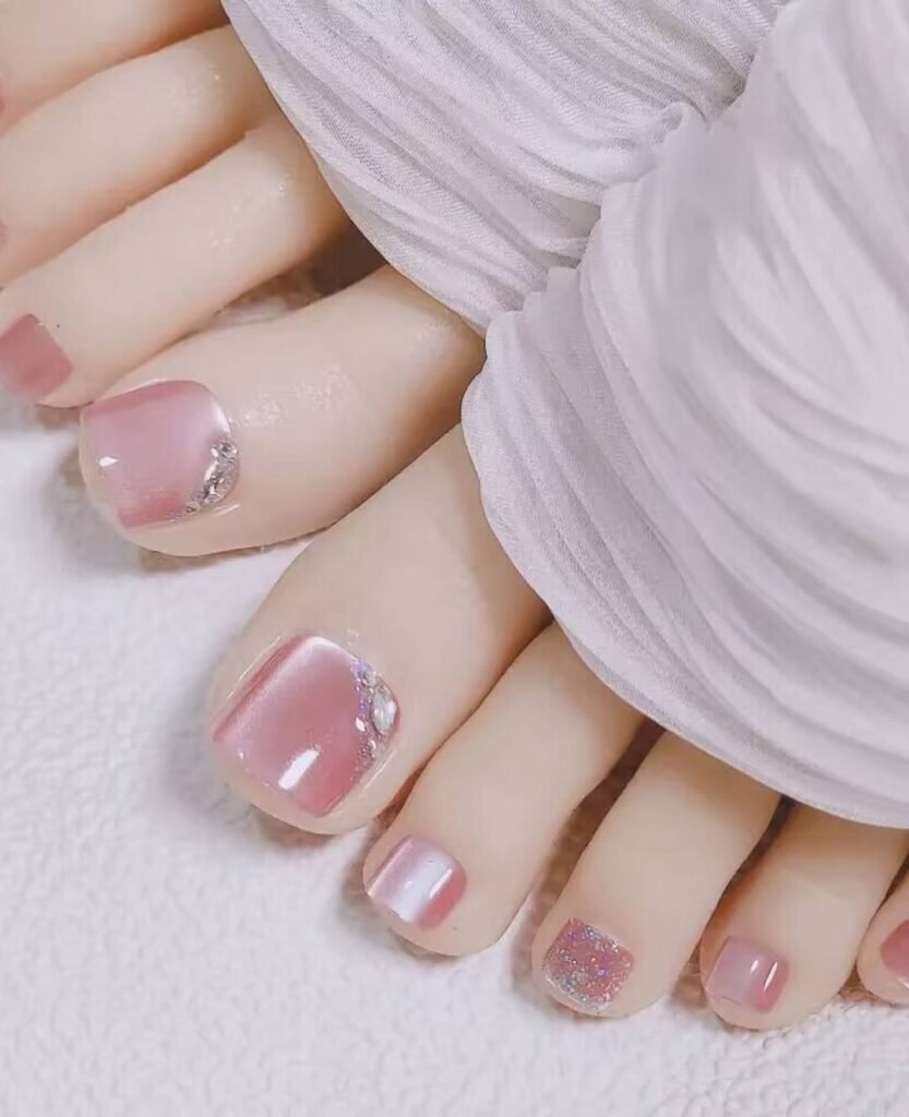 "2025 short toenail trends: minimalist geometric designs in earth tones with chrome accents, Korean-inspired negative space, low-maintenance styles."