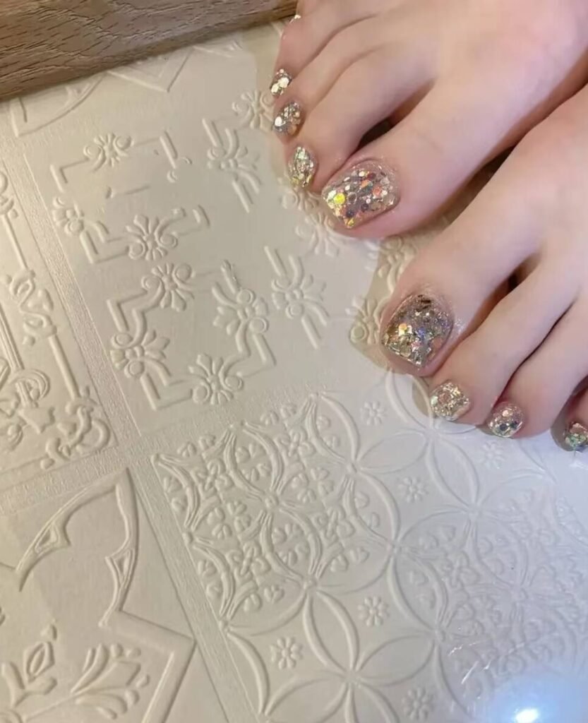 "2025 short toenail trends: minimalist geometric designs in earth tones with chrome accents, Korean-inspired negative space, low-maintenance styles."