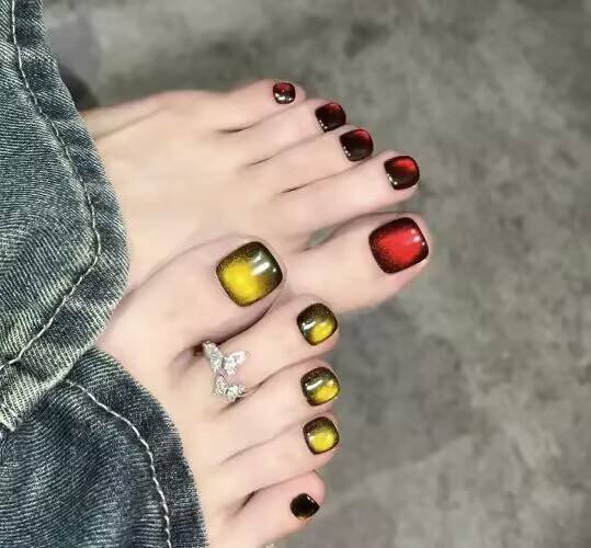 Summer pedicure ideas："Orange-yellow pedicure with coconut pattern for summer sandals"