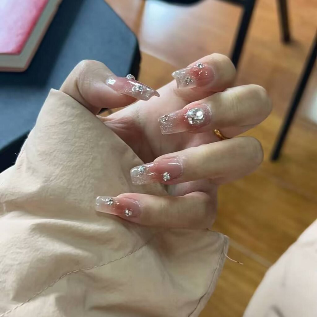 "Icy translucent nails with delicate shimmer, showcasing the latest ice translucent nail trends in glossy, frosty elegance."