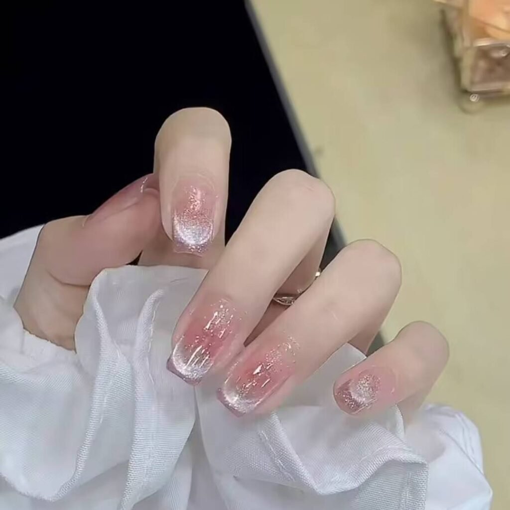 "Icy translucent nails with delicate shimmer, showcasing the latest ice translucent nail trends in glossy, frosty elegance."
