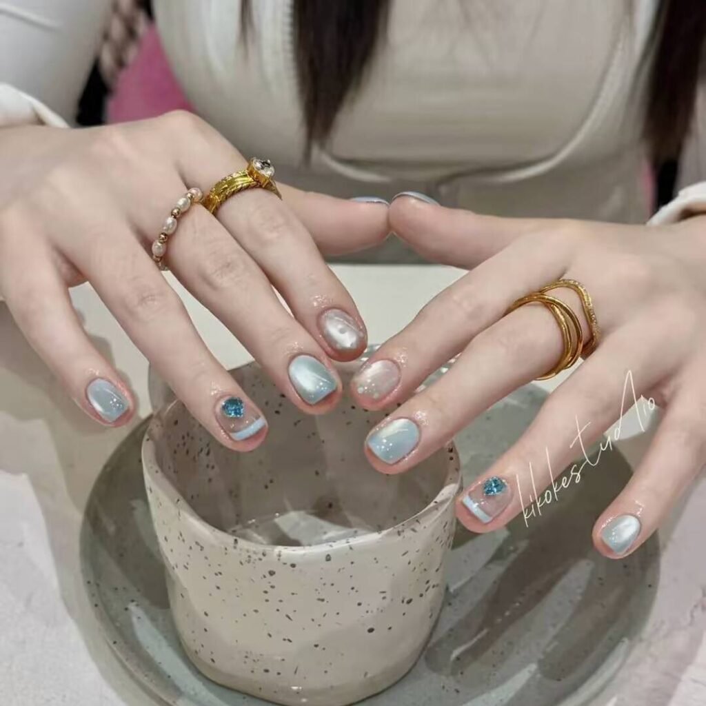 "Icy translucent nails with delicate shimmer, showcasing the latest ice translucent nail trends in glossy, frosty elegance."