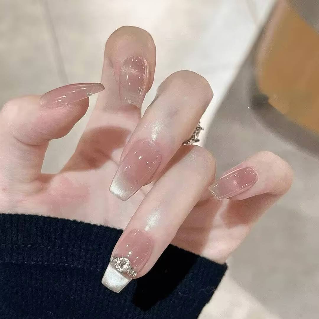 "Icy translucent nails with delicate shimmer, showcasing the latest ice translucent nail trends in glossy, frosty elegance."