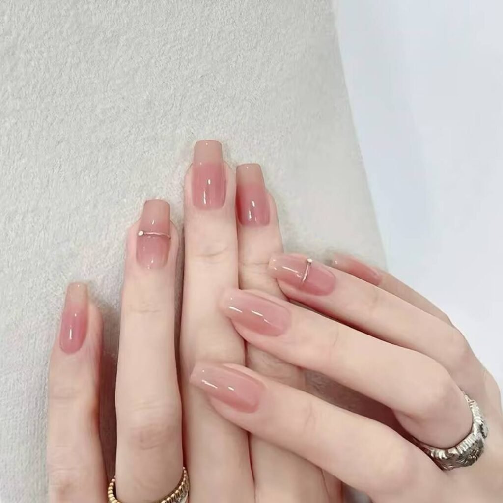 "Icy translucent nails with delicate shimmer, showcasing the latest ice translucent nail trends in glossy, frosty elegance."