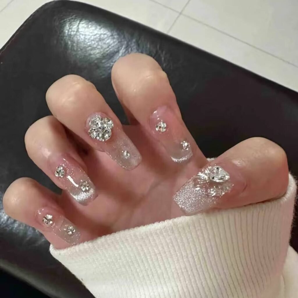 "Icy translucent nails with delicate shimmer, showcasing the latest ice translucent nail trends in glossy, frosty elegance."