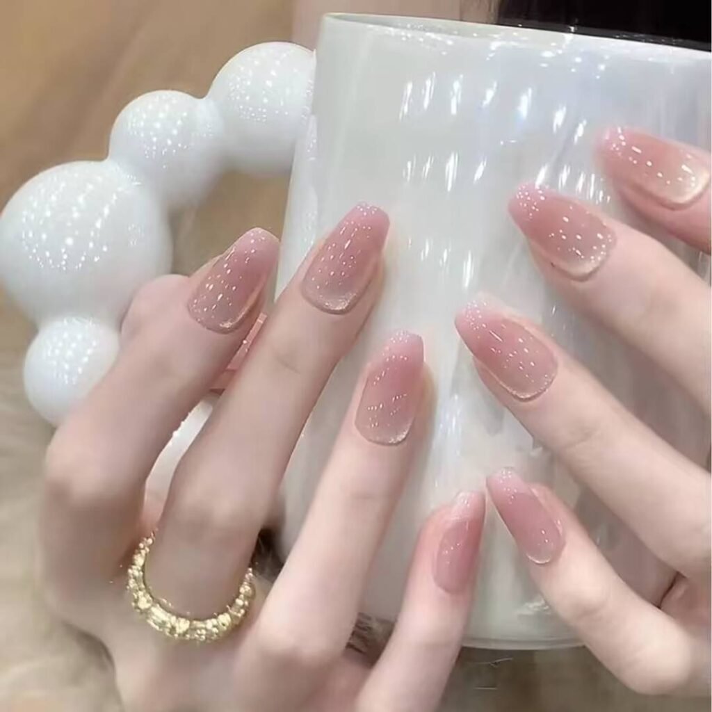 "Icy translucent nails with delicate shimmer, showcasing the latest ice translucent nail trends in glossy, frosty elegance."