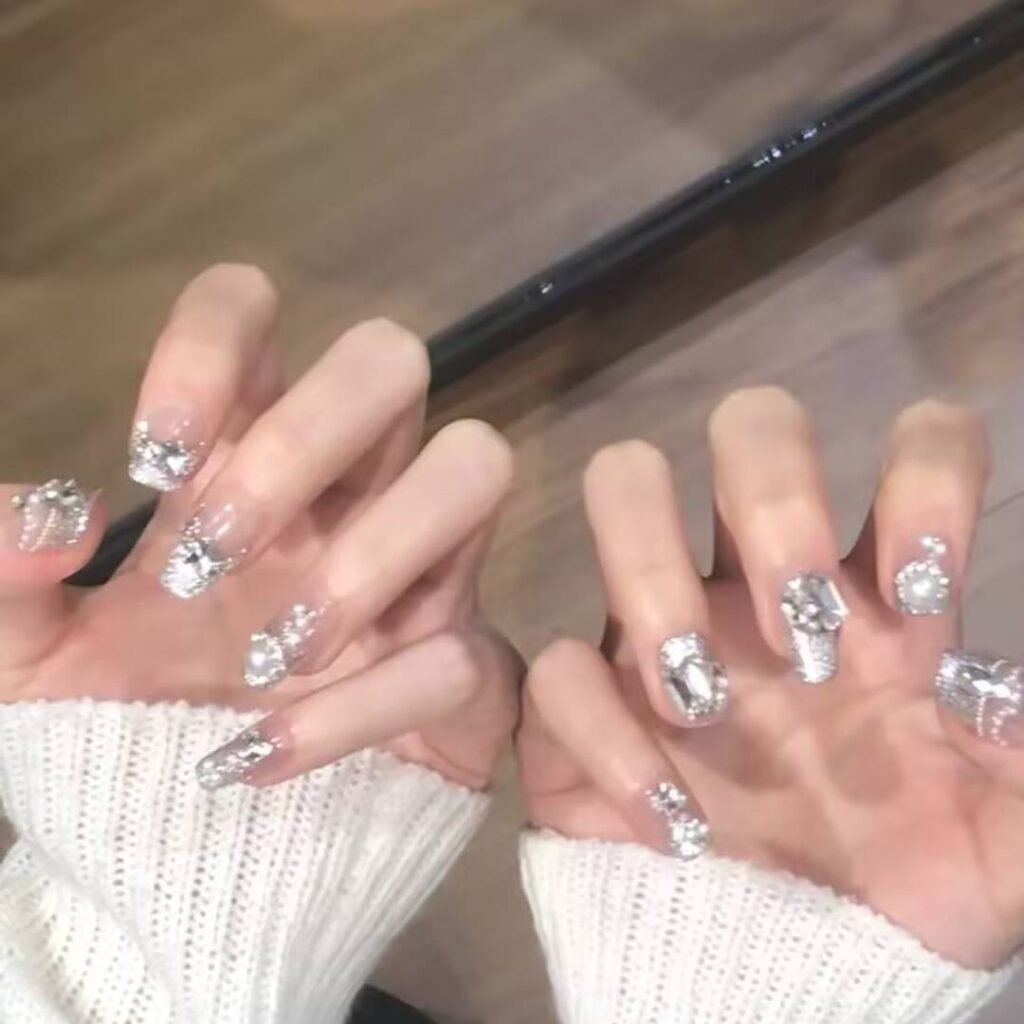 "Icy translucent nails with delicate shimmer, showcasing the latest ice translucent nail trends in glossy, frosty elegance."