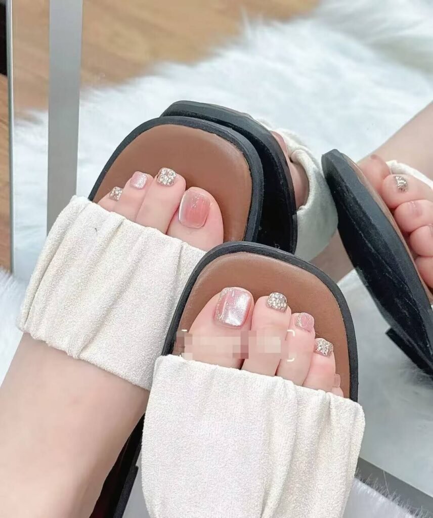 Ankle-flattering pedicures:Cream Shell White Pedicure with minimalist pearl finish - clean toe nail aesthetic