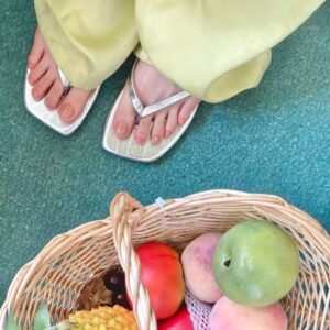 INS inspired toe nail art：Holographic French pedicure on tan feet at beach