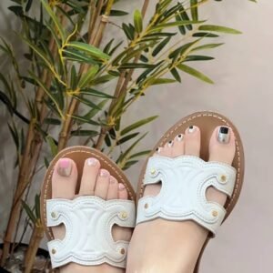 INS inspired toe nail art：Holographic French pedicure on tan feet at beach