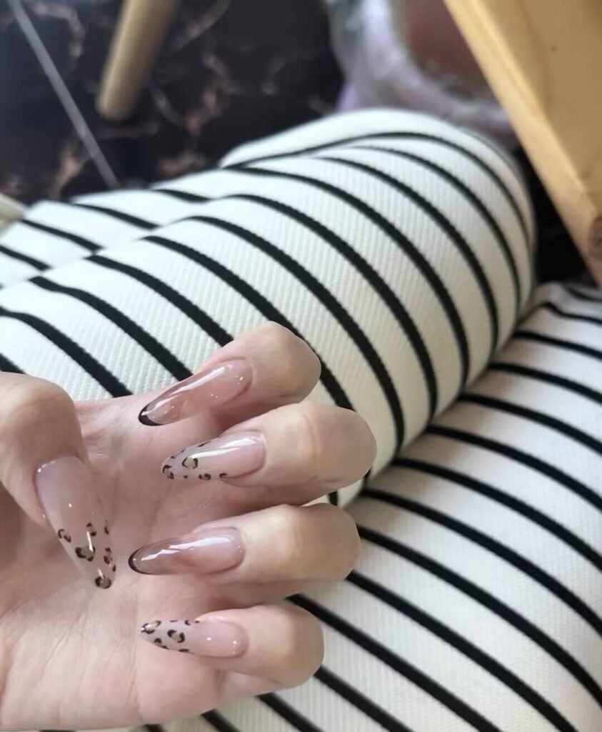 Swatches of flattering nail colors for fair skin: pale pink, peach nude, mauve, and sheer red