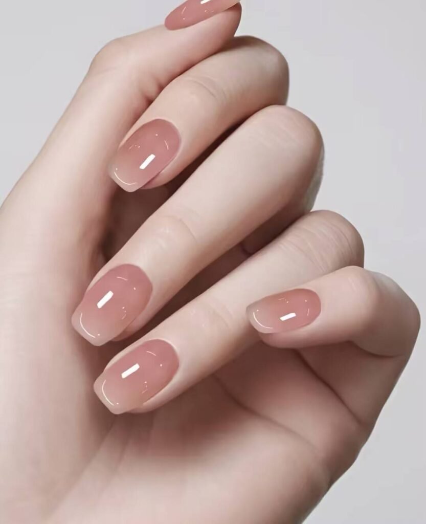 Swatches of flattering nail colors for fair skin: pale pink, peach nude, mauve, and sheer red
