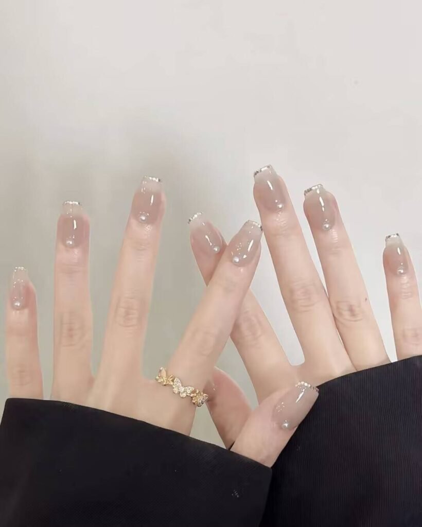 Swatches of flattering nail colors for fair skin: pale pink, peach nude, mauve, and sheer red