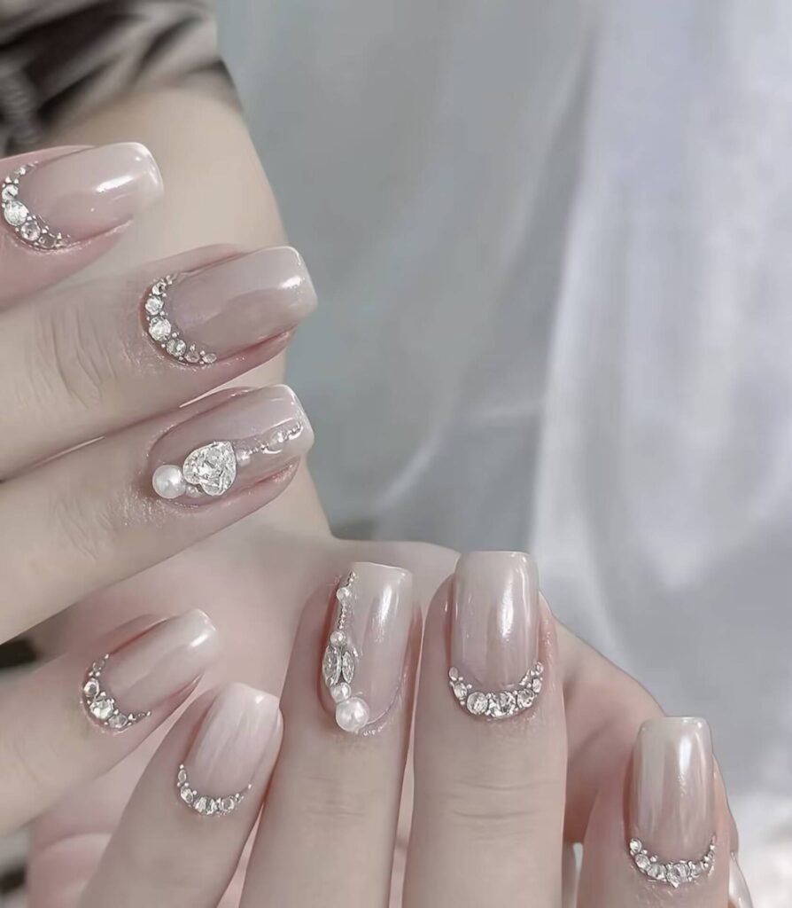 Swatches of flattering nail colors for fair skin: pale pink, peach nude, mauve, and sheer red
