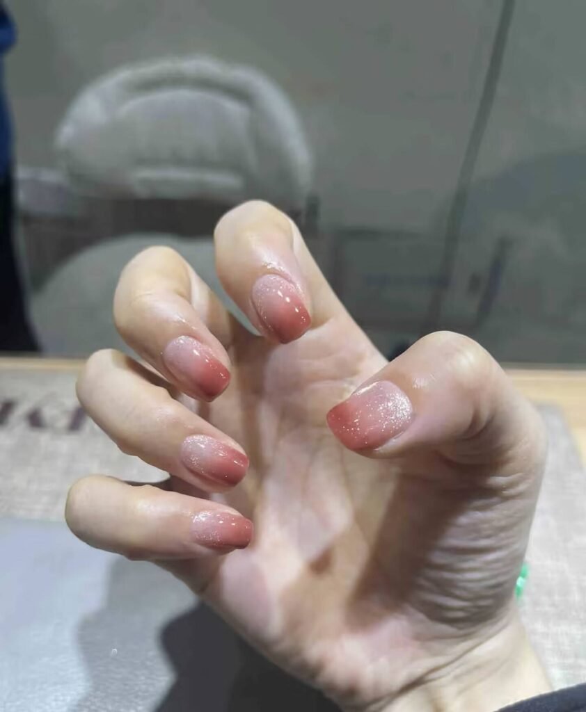 Swatches of flattering nail colors for fair skin: pale pink, peach nude, mauve, and sheer red