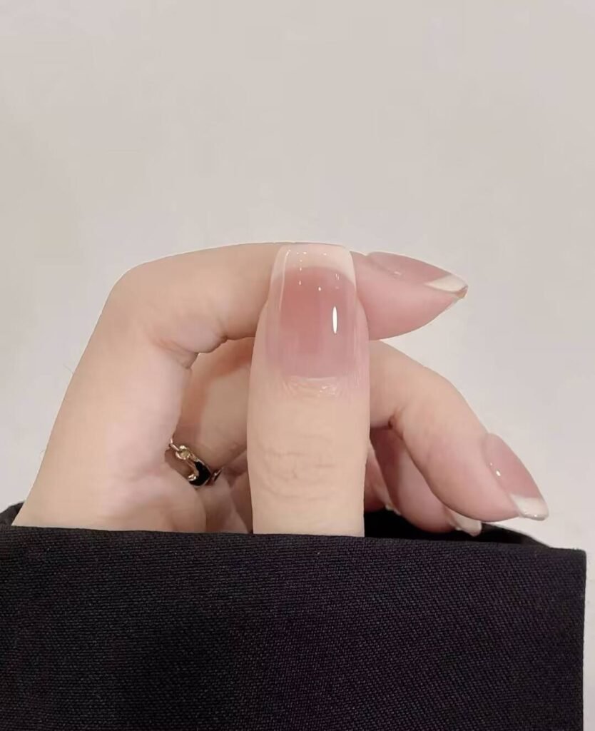 Swatches of flattering nail colors for fair skin: pale pink, peach nude, mauve, and sheer red