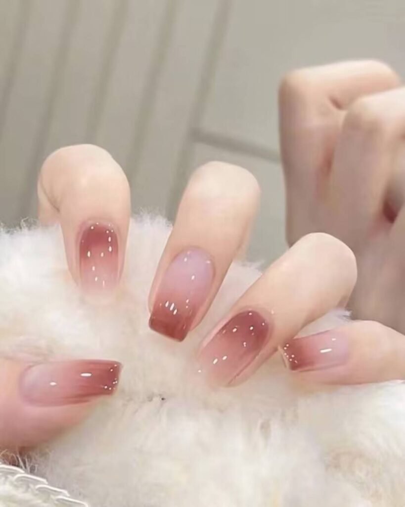 Short, elegant nail designs featuring minimalist styles like French tips, soft nude polish, and delicate gold accents on natural nails.