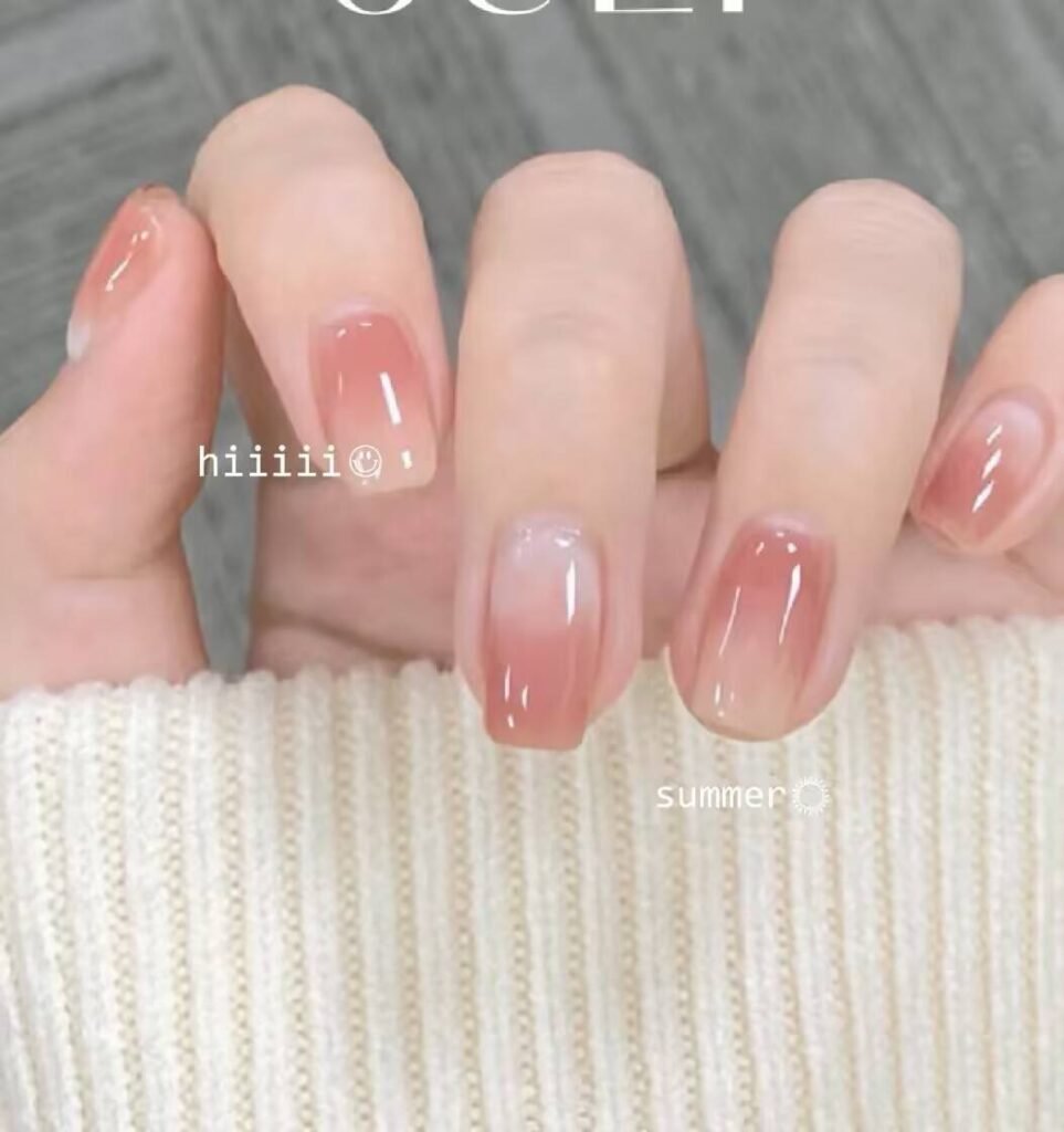 Short, elegant nail designs featuring minimalist styles like French tips, soft nude polish, and delicate gold accents on natural nails.