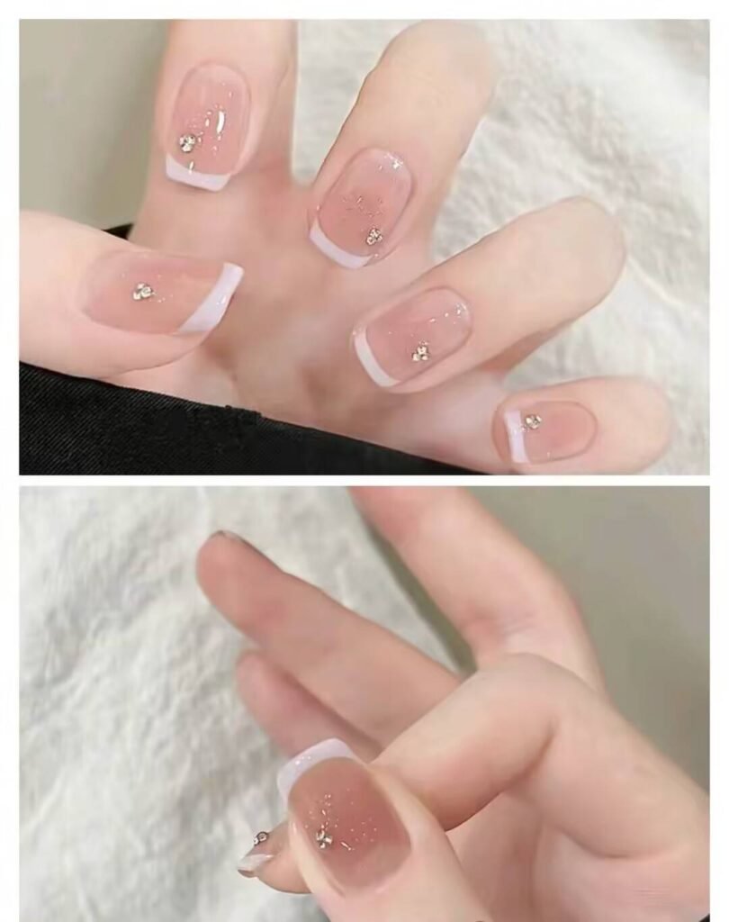 Short, elegant nail designs featuring minimalist styles like French tips, soft nude polish, and delicate gold accents on natural nails.