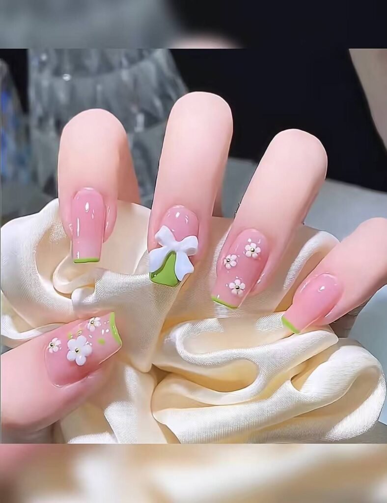 Minimalist spring nail 2025 trends: sheer blush base with subtle chrome half-moon accents.