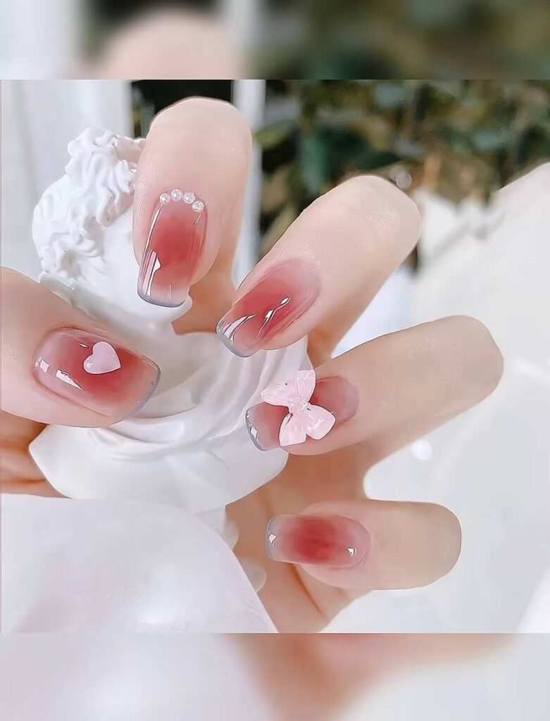 Minimalist spring nail 2025 trends: sheer blush base with subtle chrome half-moon accents.