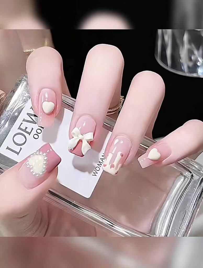 Minimalist spring nail 2025 trends: sheer blush base with subtle chrome half-moon accents.