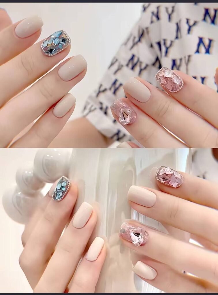 Minimalist spring nail 2025 trends: sheer blush base with subtle chrome half-moon accents.