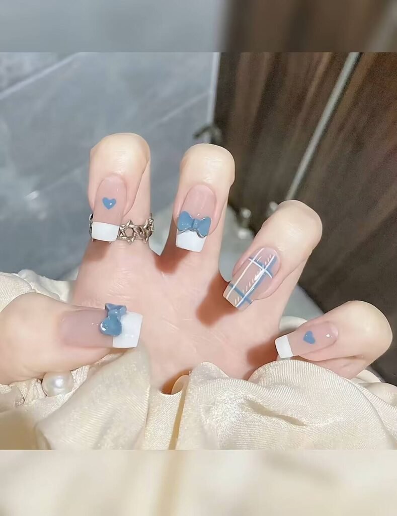 Minimalist spring nail 2025 trends: sheer blush base with subtle chrome half-moon accents.