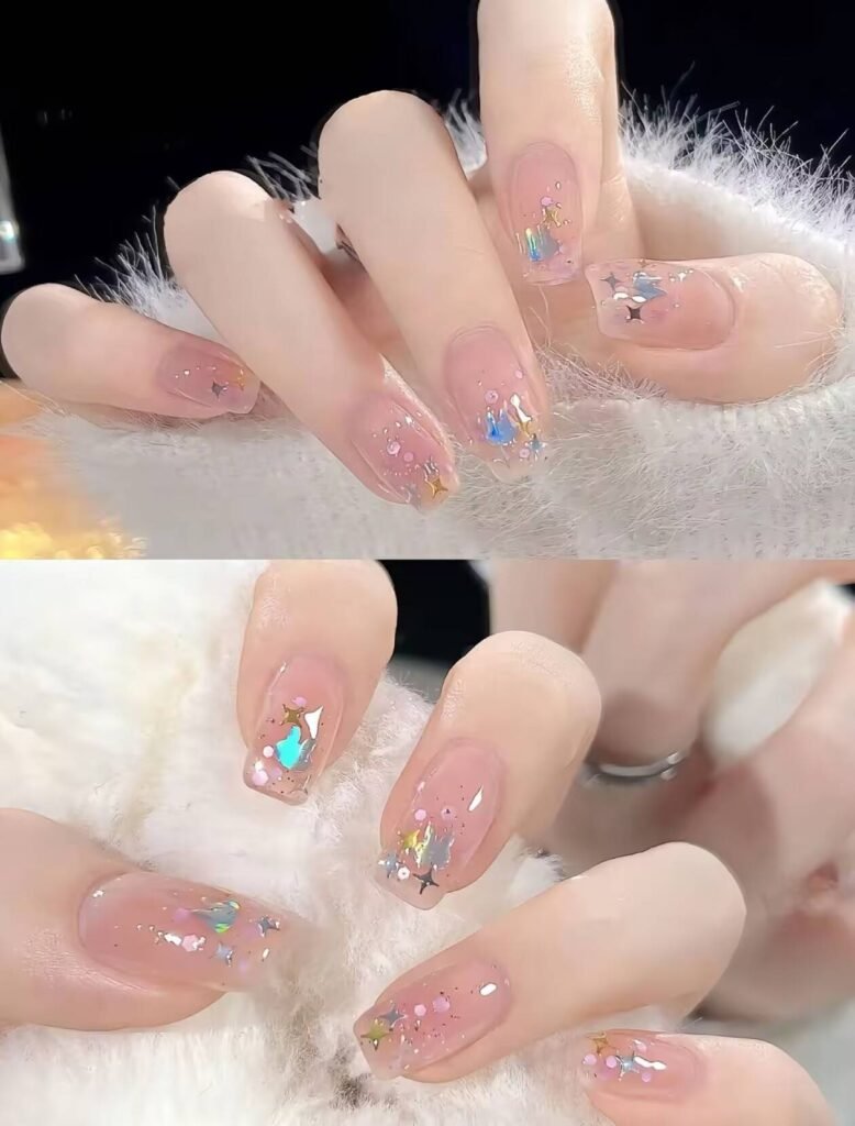 Minimalist spring nail 2025 trends: sheer blush base with subtle chrome half-moon accents.
