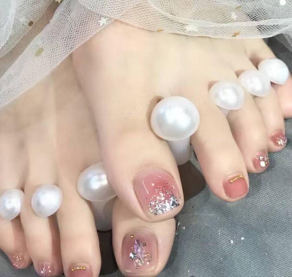 Cozy and luxurious winter pedicure styles 2025 with rich jewel tones and frosty metallic details.