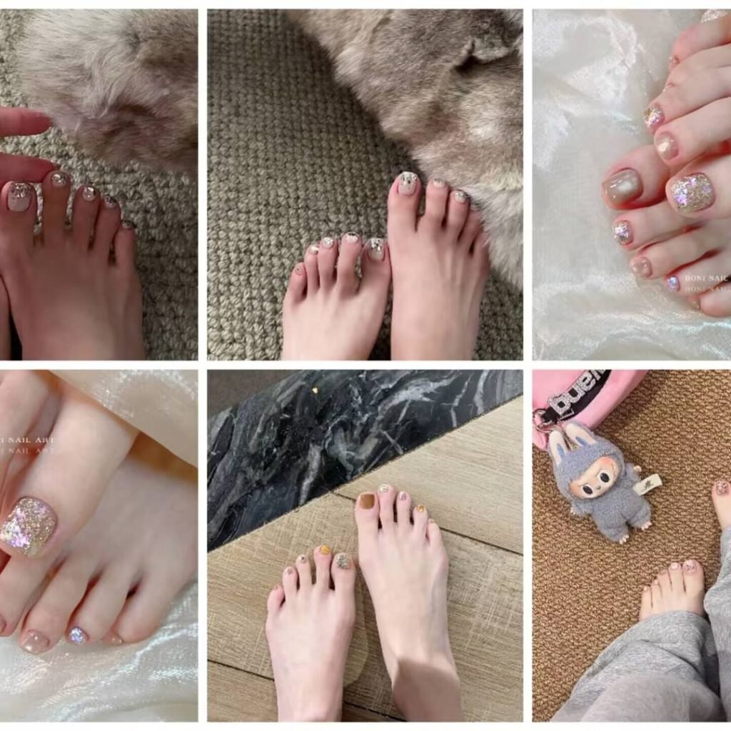 Manicured fair-skinned feet featuring toenails painted in a soft pink shade.