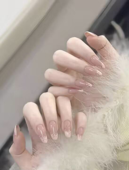 Trendy INS viral nail styles featuring gradient colors, glitter accents, and geometric designs on natural nails.