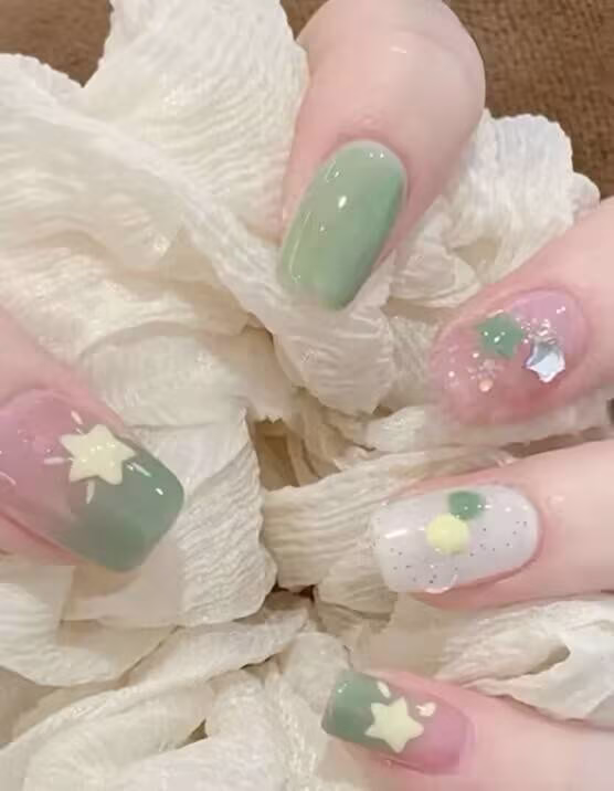Trendy INS viral nail styles featuring gradient colors, glitter accents, and geometric designs on natural nails.