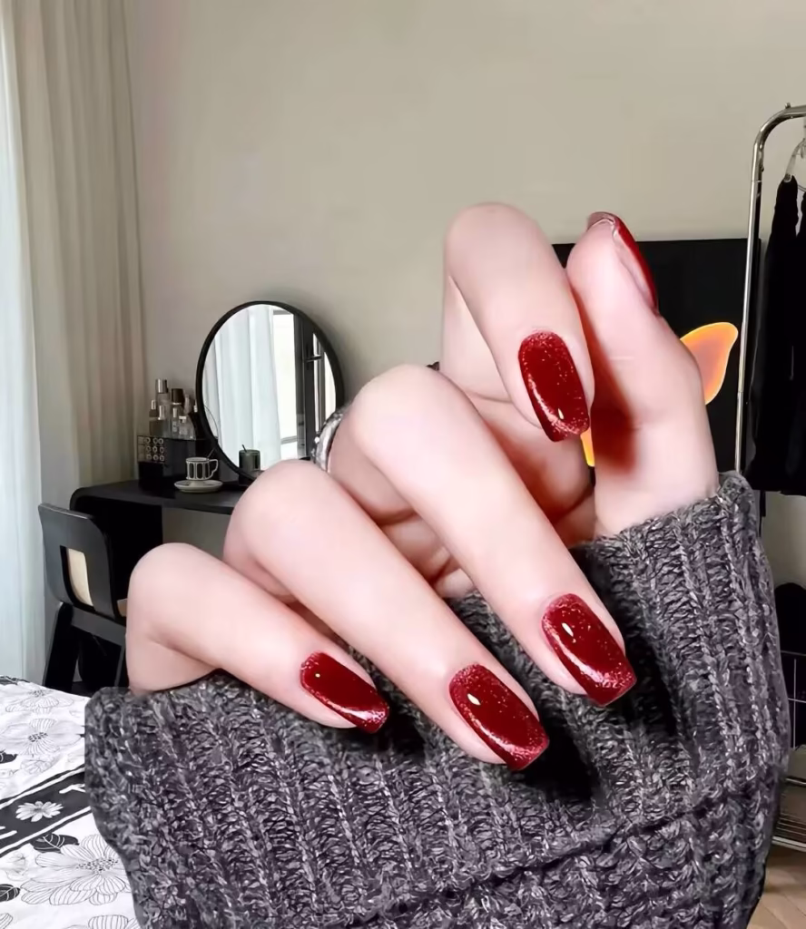Skin Brightening Manicure Styles featuring pearlized nude polish with delicate glitter tips and subtle chrome accents.