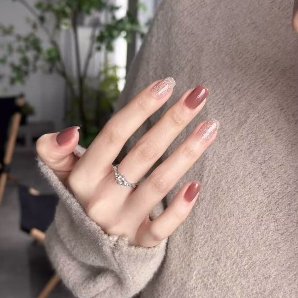 Trending Short Nail Designs: French tip with nude pink base and silver metallic accents