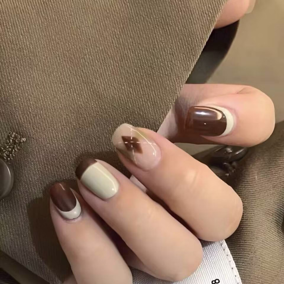 Trending Short Nail Designs: French tip with nude pink base and silver metallic accents