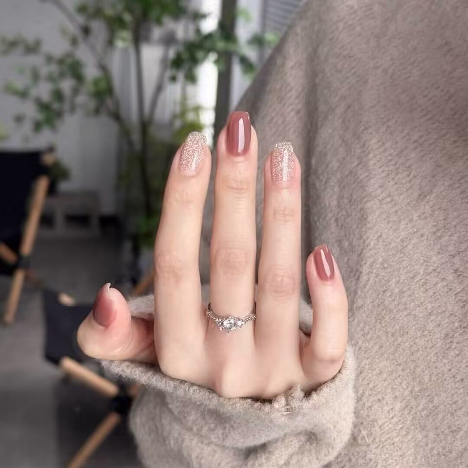 Trending Short Nail Designs: French tip with nude pink base and silver metallic accents