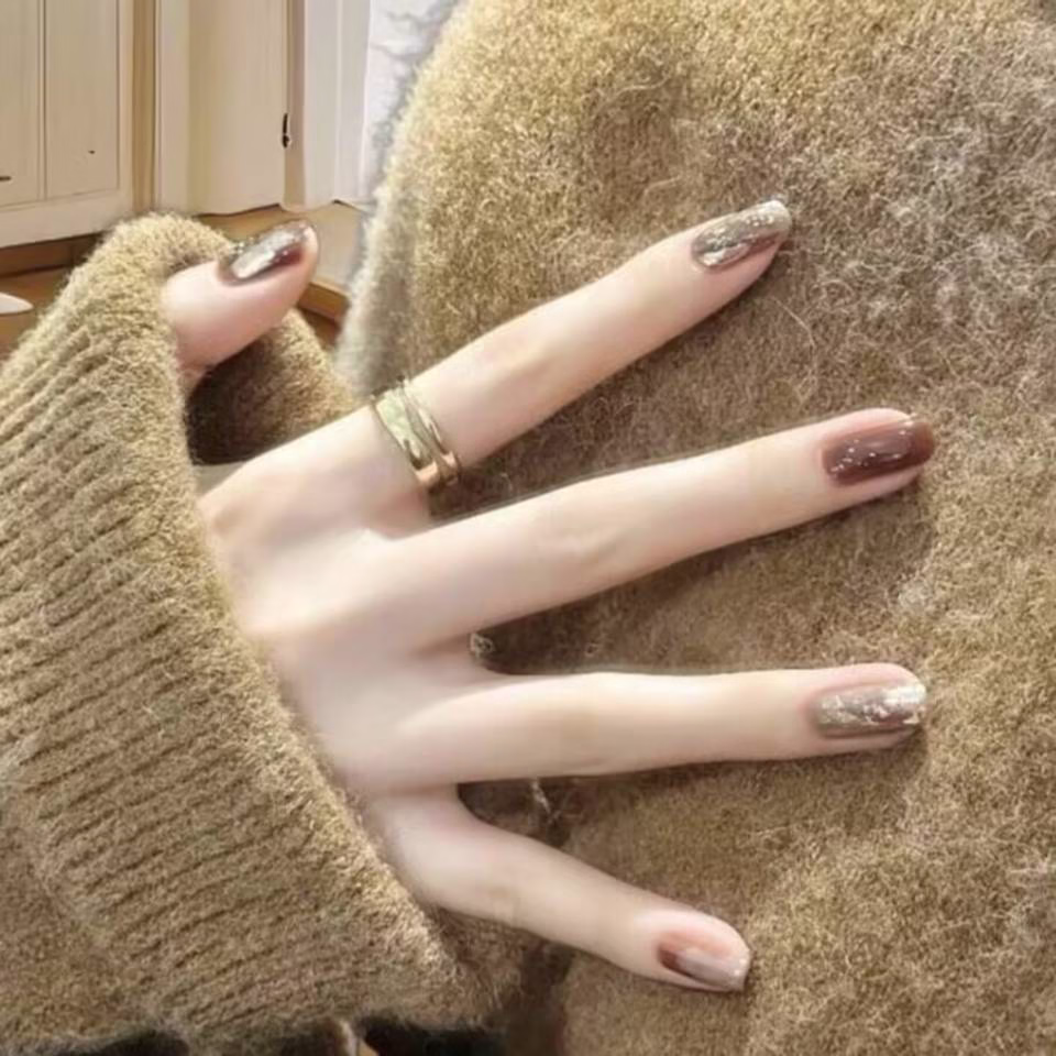 Trending Short Nail Designs: French tip with nude pink base and silver metallic accents