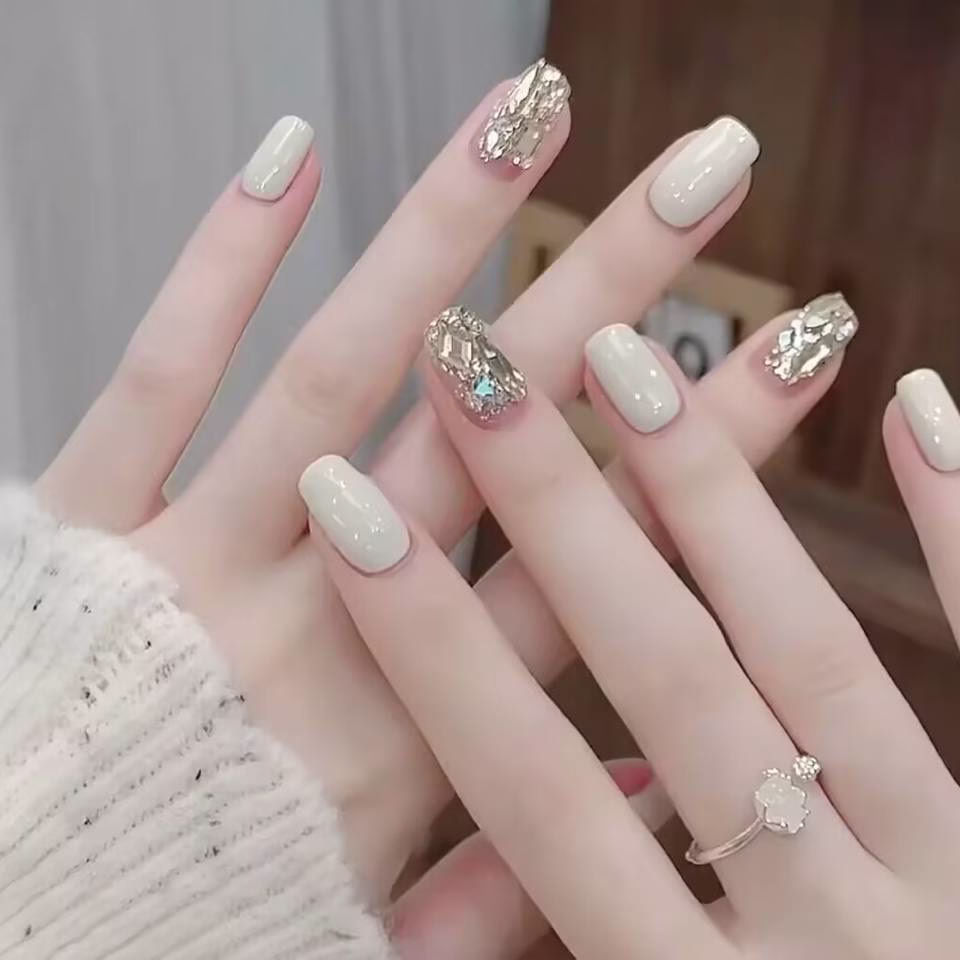 Trending Short Nail Designs: French tip with nude pink base and silver metallic accents