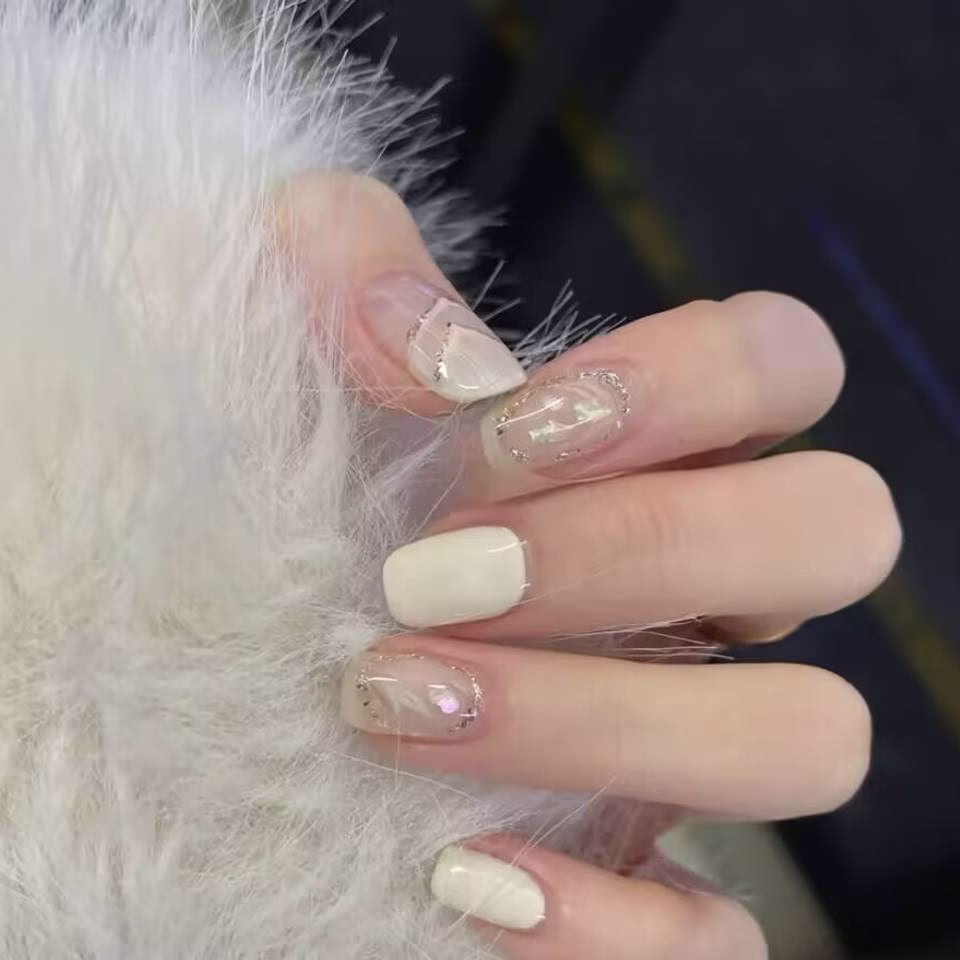 Trending Short Nail Designs: French tip with nude pink base and silver metallic accents