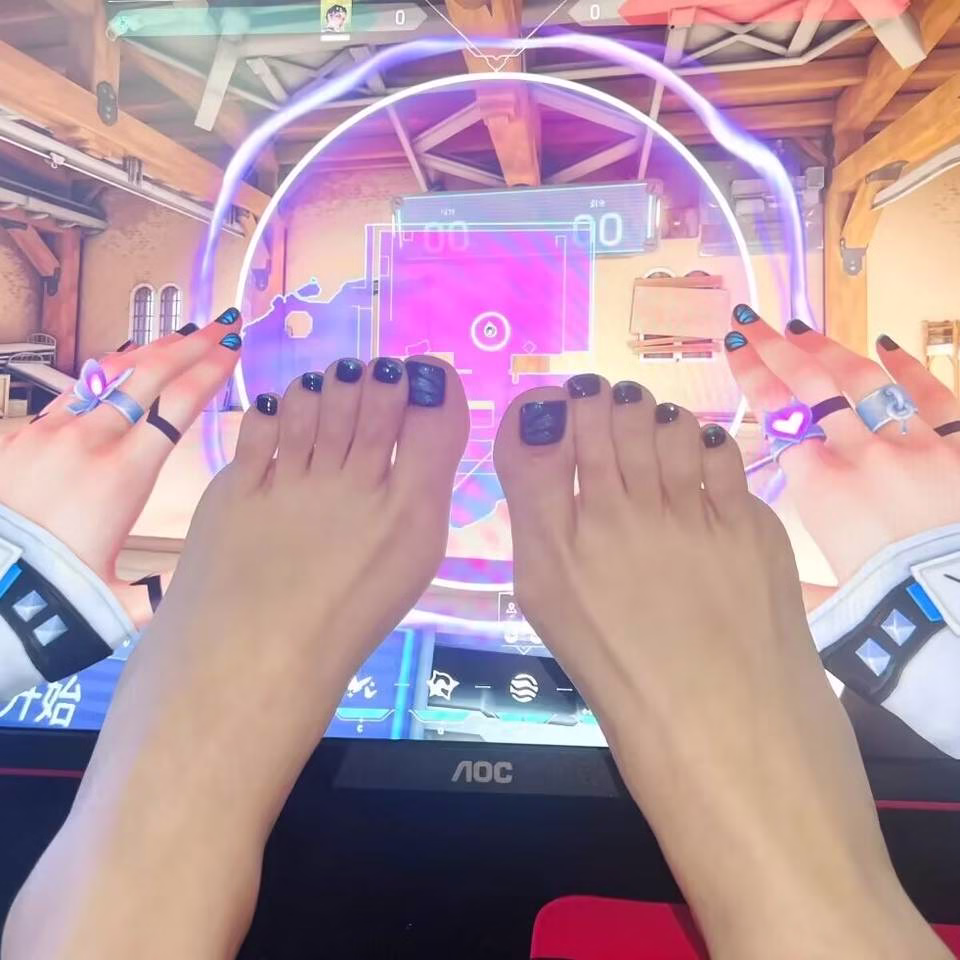  Close-up view of whimsical fairy pedicure designs featuring delicate glitter gradients, tiny floral accents, and ethereal wing motifs on toenails, in soft pastel and iridescent colors.